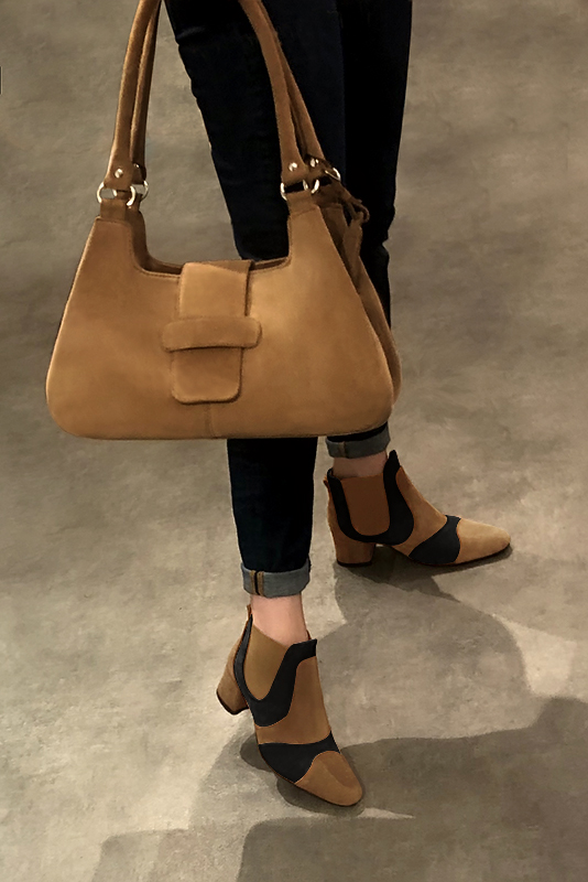 Biscuit beige and matt black women's ankle boots, with elastics. Round toe. Low flare heels. Worn view - Florence KOOIJMAN